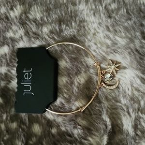 Gold tone charm bracelet